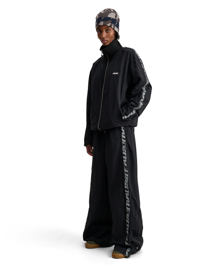 ALIS TEEFEY TRACK PANTS W/ LOGO TAPE Track pants