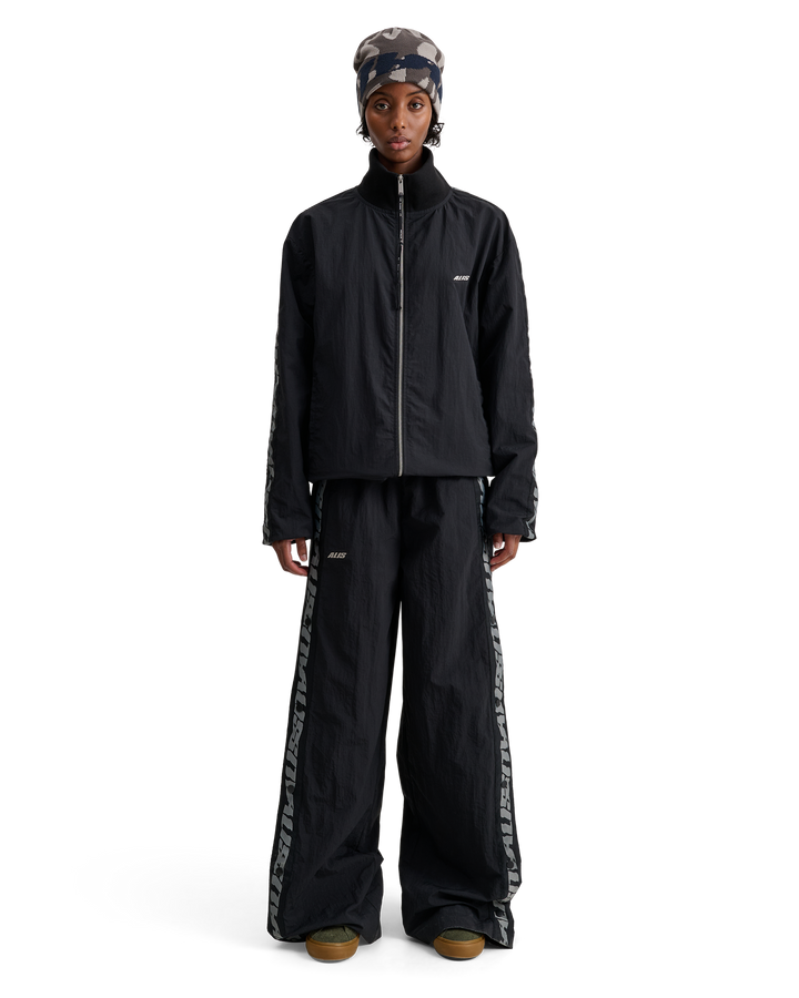 ALIS TEEFEY TRACK PANTS W/ LOGO TAPE Track pants